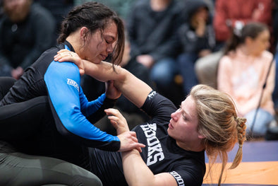 Tayla Ford and Nora Naomi Schultz grapple at the M16 Open wearing Hooks BJJ gear