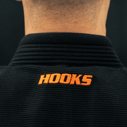Black gi with 'HOOKS' logo on the back against a black background
