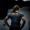 Elevate your No Gi game with the Just Jits Short Sleeve Rashguard - 8 Bit! Engineered for durability and performance in Brazilian Jiu Jitsu.
