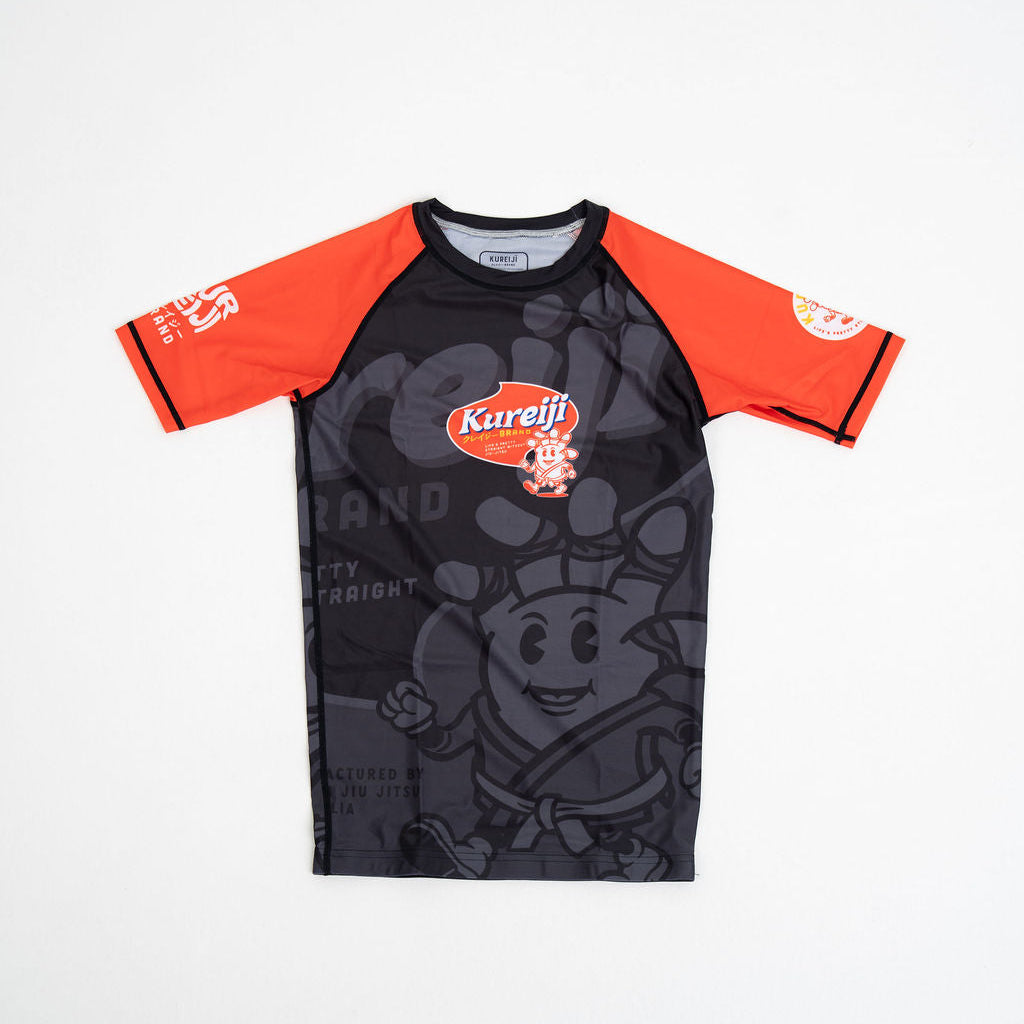 Black and orange shirt with cartoon character and brand logo on a white background
