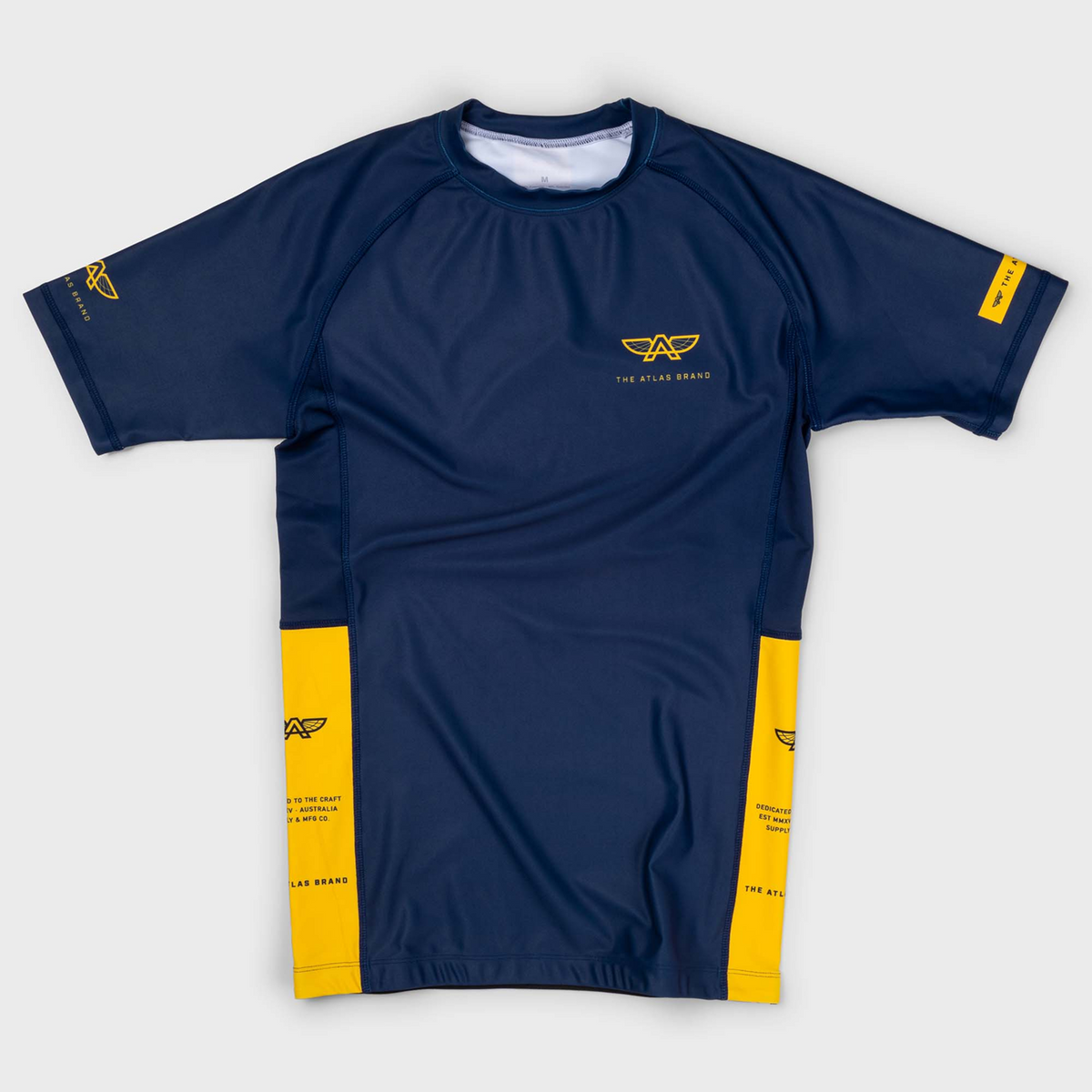 The Atlas Brand - Women's Apex S7 Solaris Rash Guard flat lay