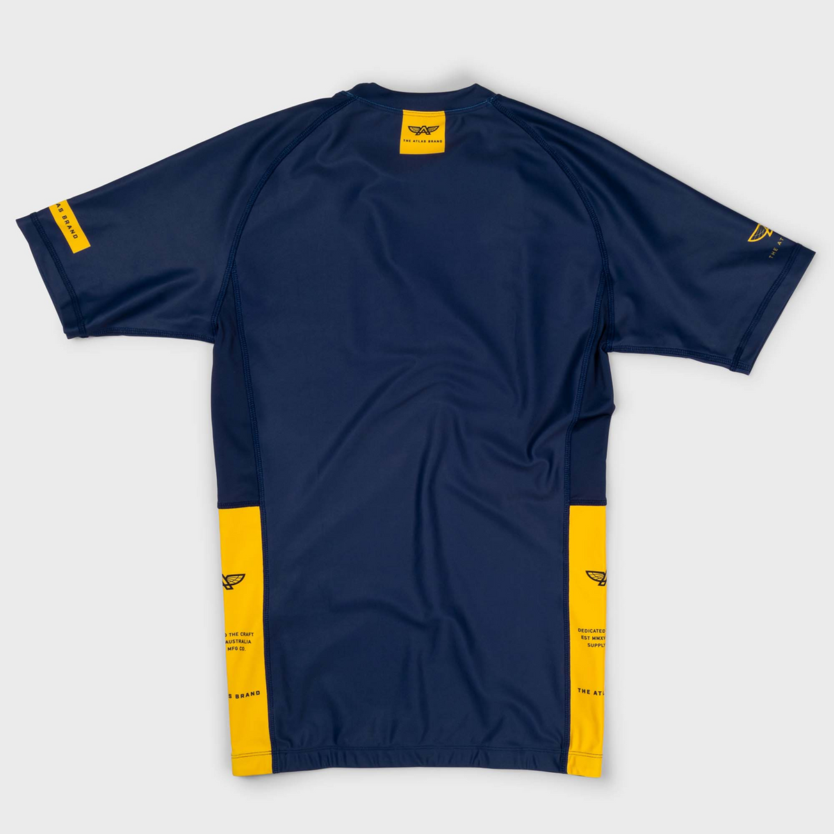The Atlas Brand - Women's Apex S7 Solaris Rash Guard flat lay