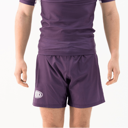 Hooks Fusion Grappling Shorts in Plum, front view worn, showing elastic waistband and logo on left leg.