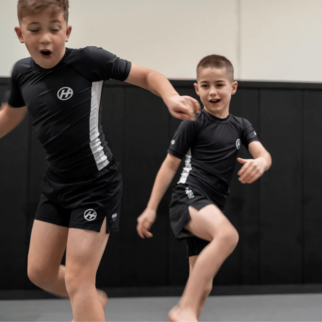 Hooks Pursuit BJJ kids rashguard and shorts when worn