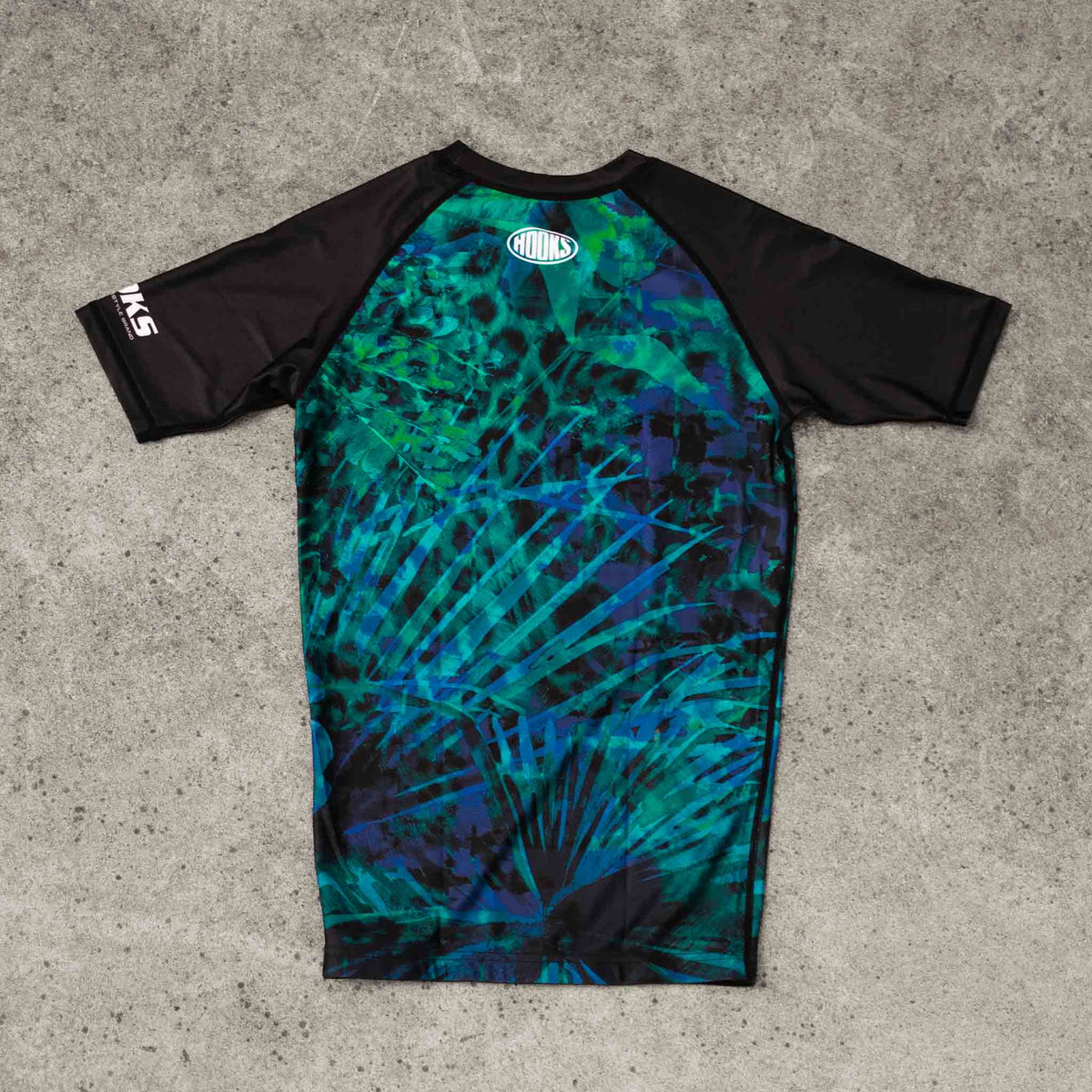 Hooks Women's Short Sleeve Rash Guard - Jungle Reign flat lay