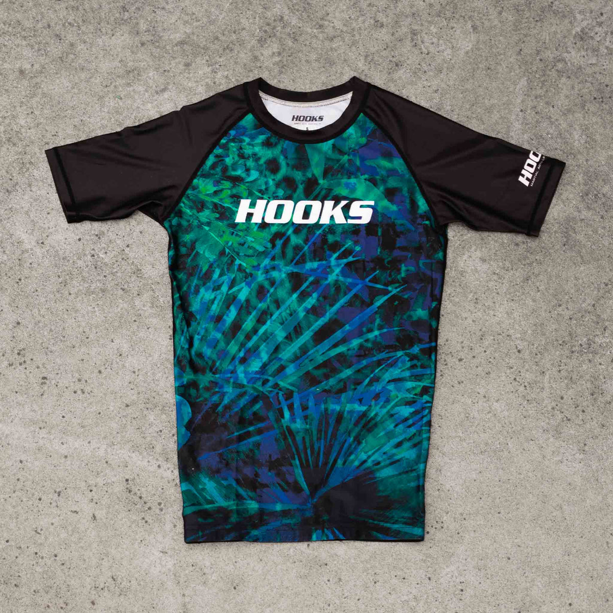 Hooks Women's Short Sleeve Rash Guard - Jungle Reign flat lay