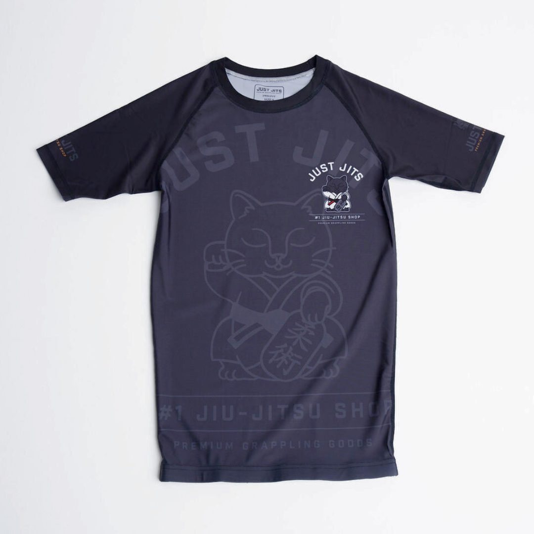 Black jiu-jitsu shirt with cat graphic and 'Just Jiu' branding on a white background