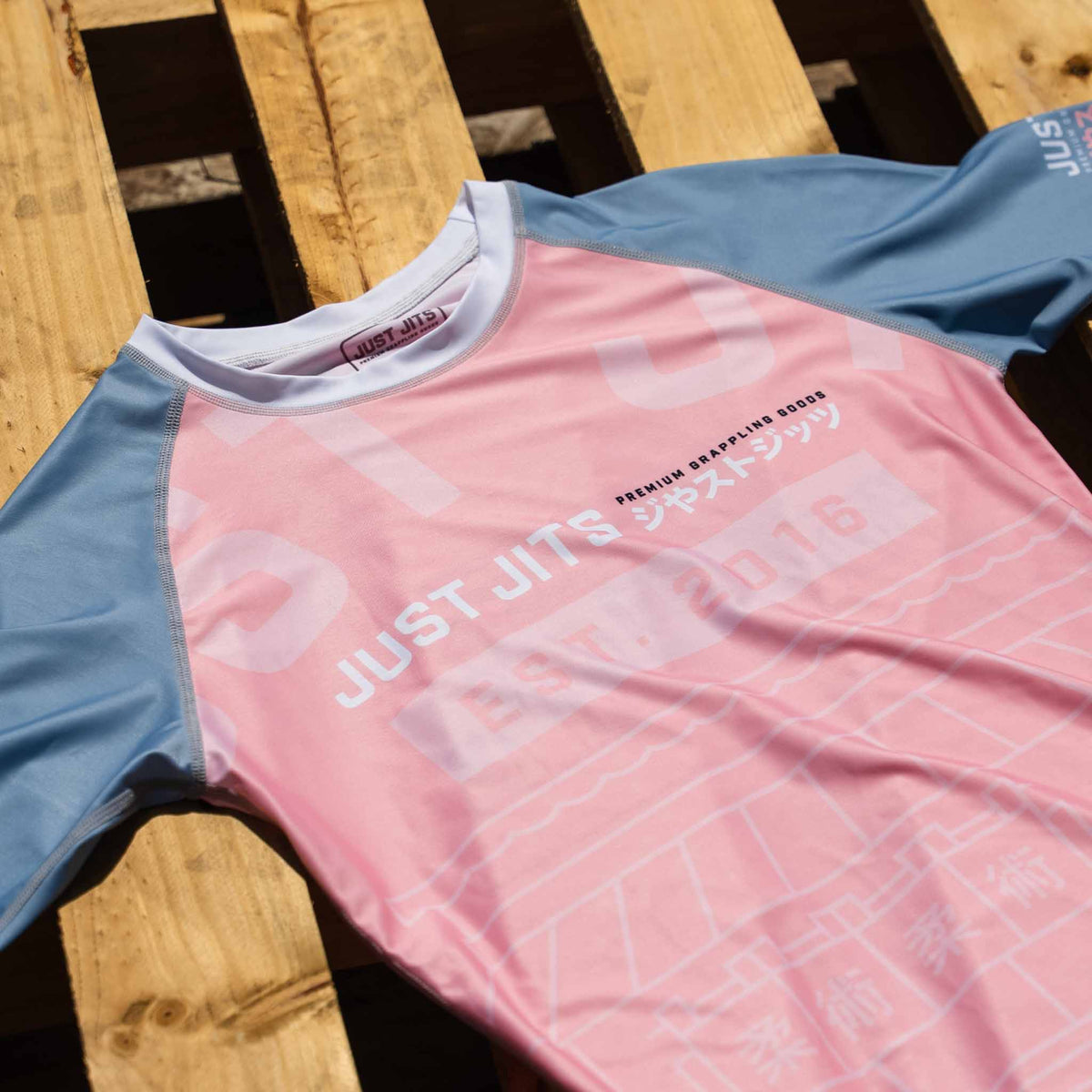 Just Jits Women's Short Sleeve Rash Guard – Sunset Sakura flat lay