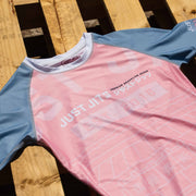 Just Jits Women's Short Sleeve Rash Guard – Sunset Sakura flat lay