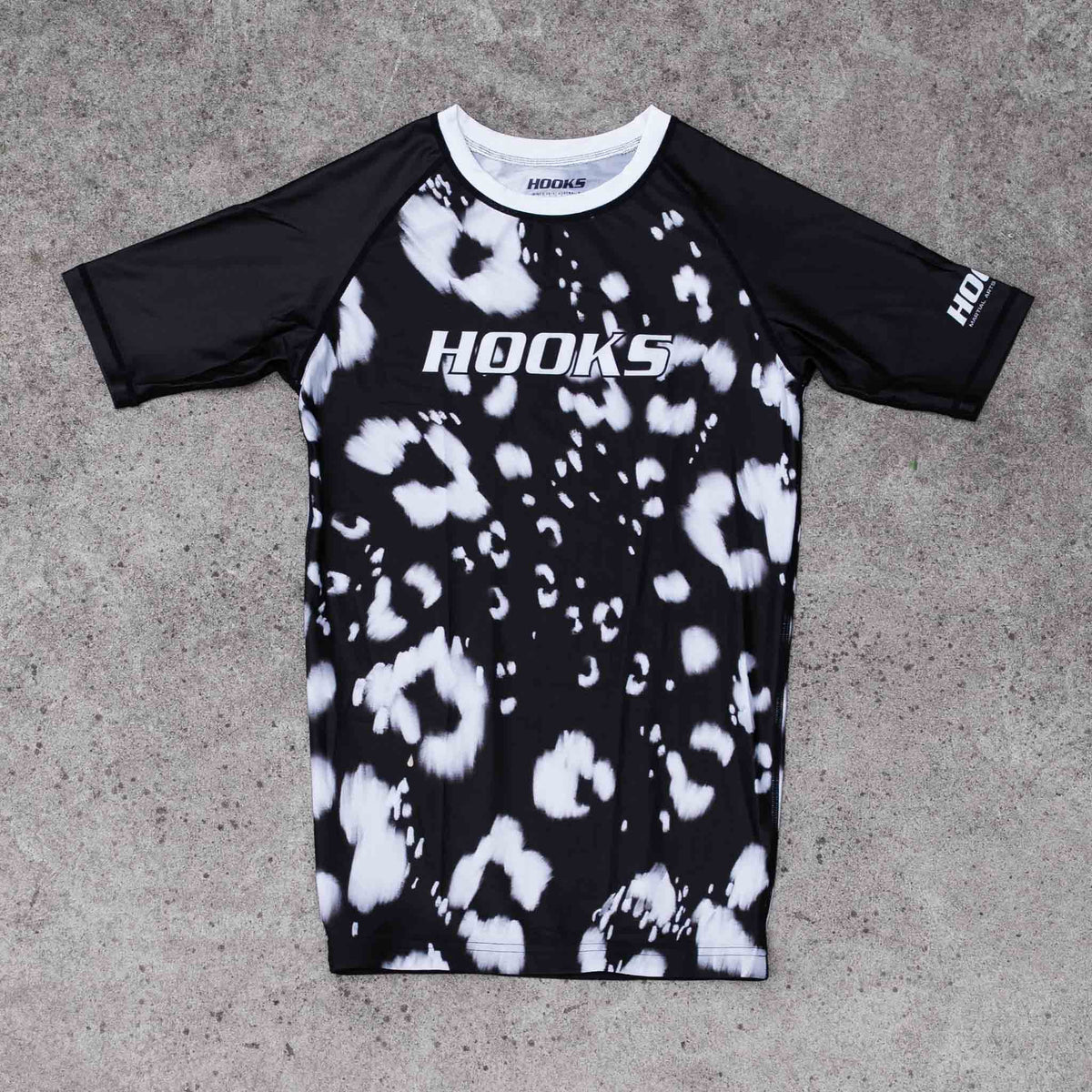 Hooks Women's Short Sleeve Rash Guard - Prowl flat lay