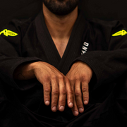 Close-up front view of The Atlas Brand ICON Black rashguard.