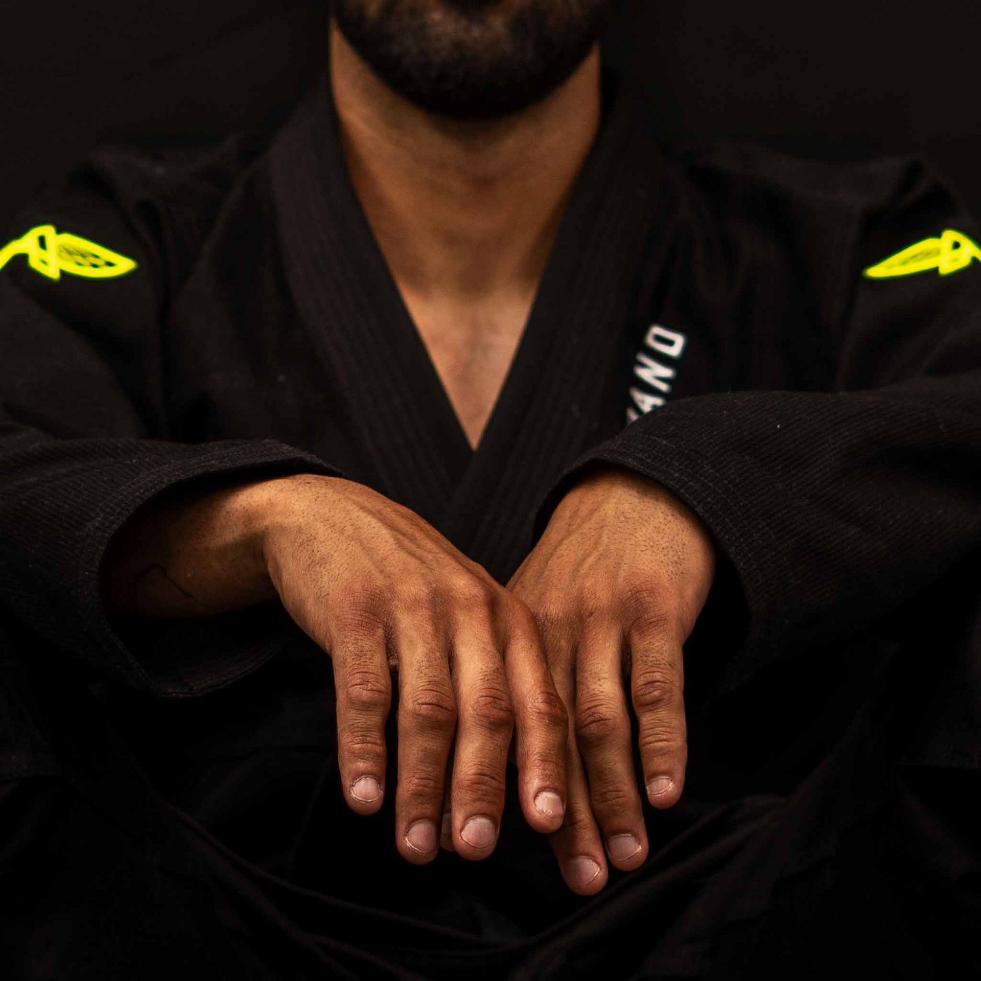 Close-up front view of The Atlas Brand ICON Black rashguard.
