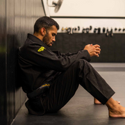 Whole body side view of The Atlas Brand ICON Black rashguard when worn.