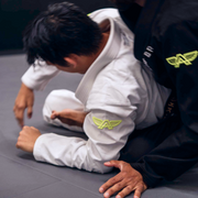 The Atlas Brand ICON White rashguard worn in action (3).