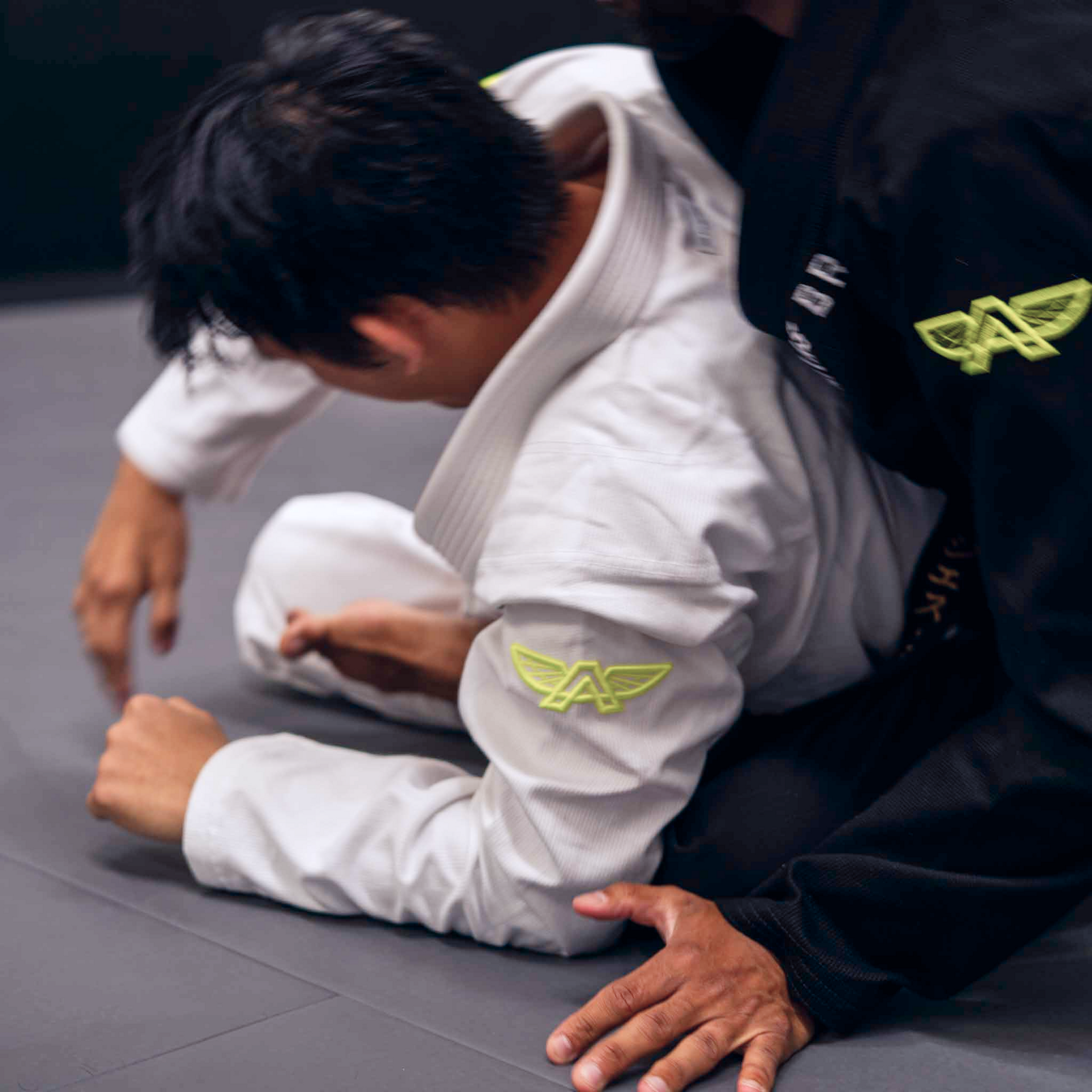 The Atlas Brand ICON White rashguard worn in action (3).