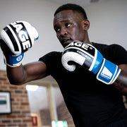 Israel Adesanya wearing boxing gloves