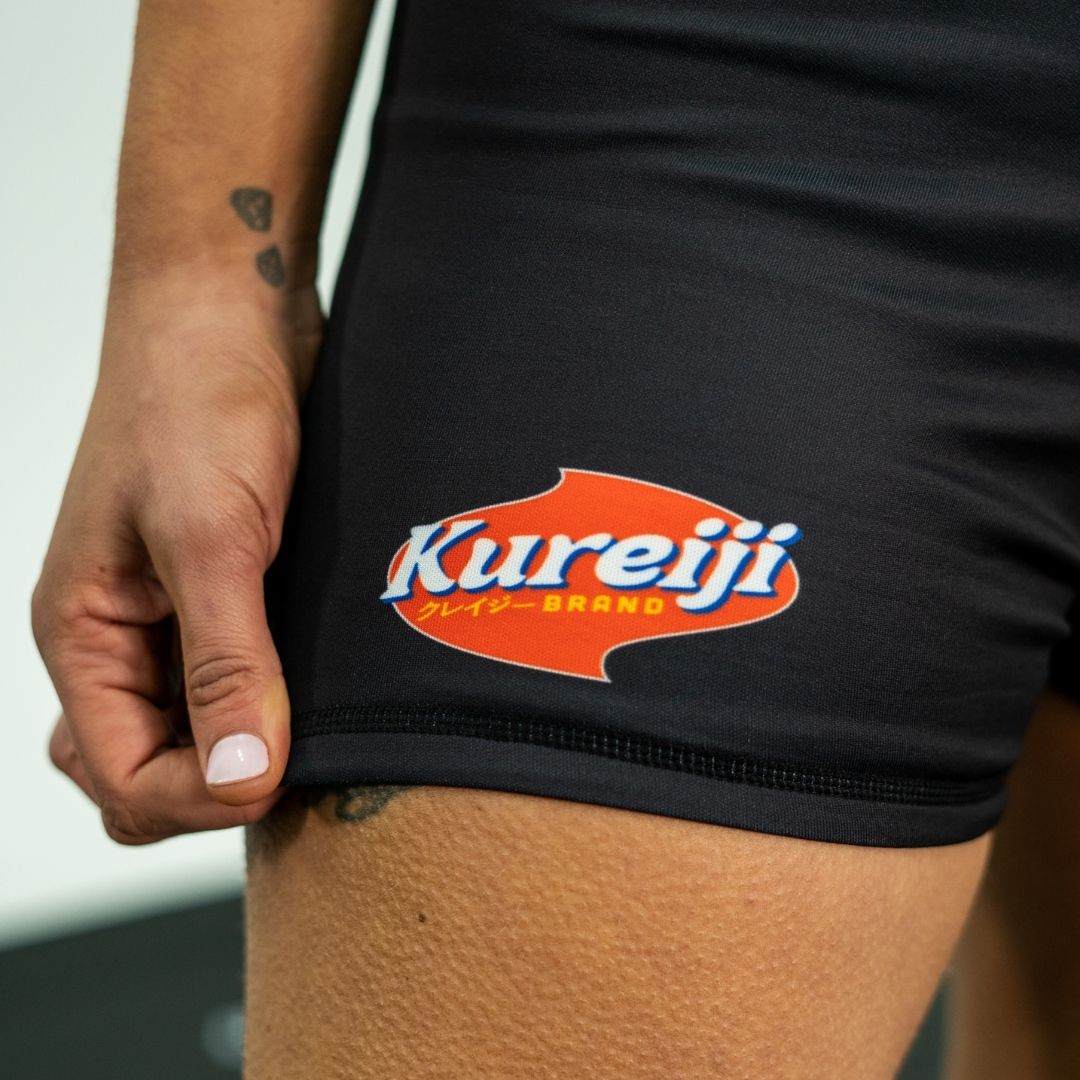 Close up detail of Kureiji BJJ Women’s Twisties Shorts Cheese side print