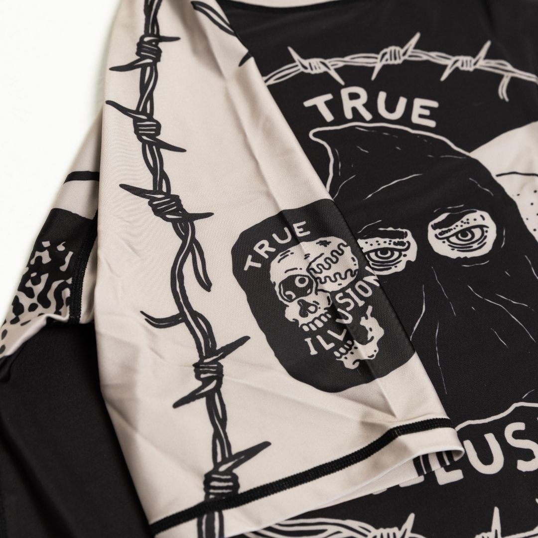 Close up of sleeve print details on Executioner BJJ rash guard
