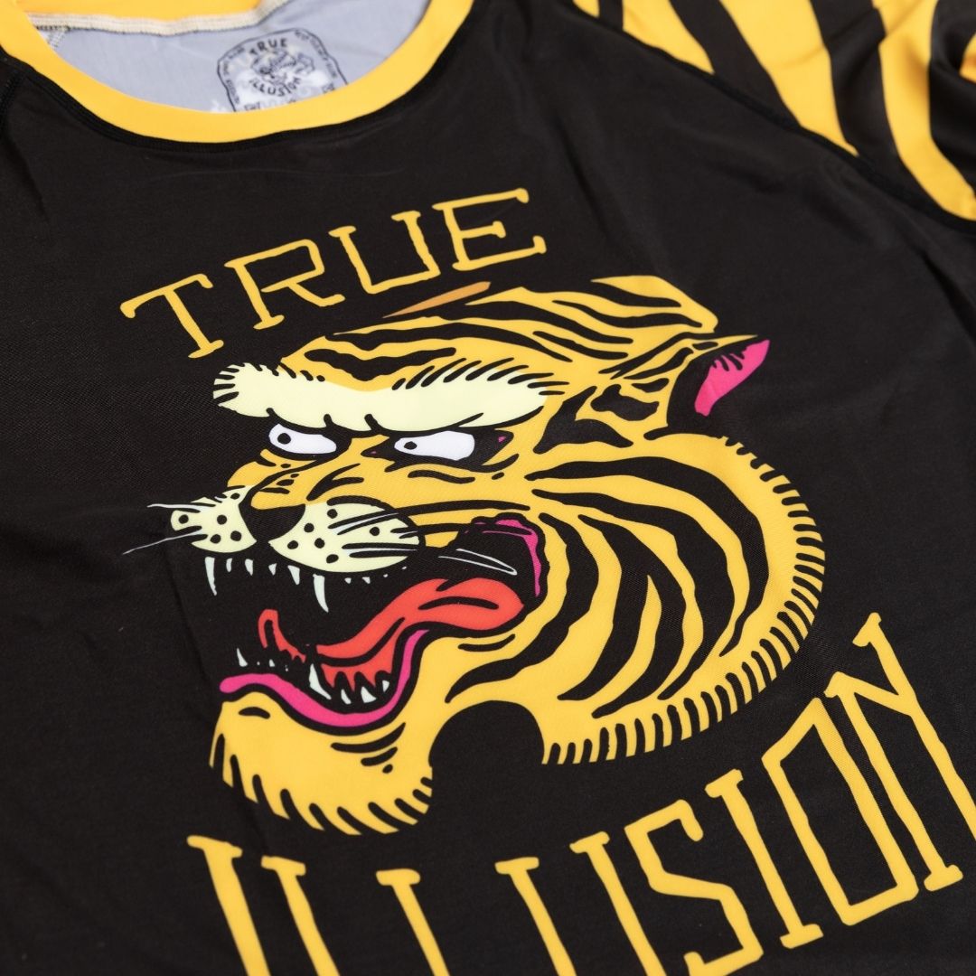 Close up of tiger print detail on front of True Illusion BJJ rash guard