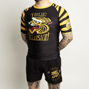 Wearing True Illusion Tiger BJJ rashguard and shorts set front view