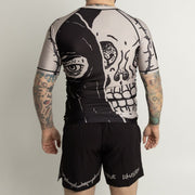 Athlete wearing Executioner BJJ rash guard and shorts set back view
