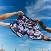 Stretch test of VHTS Trippy Tiger Series 2025 Combat Shorts Iconoclast, front design showing flexibility